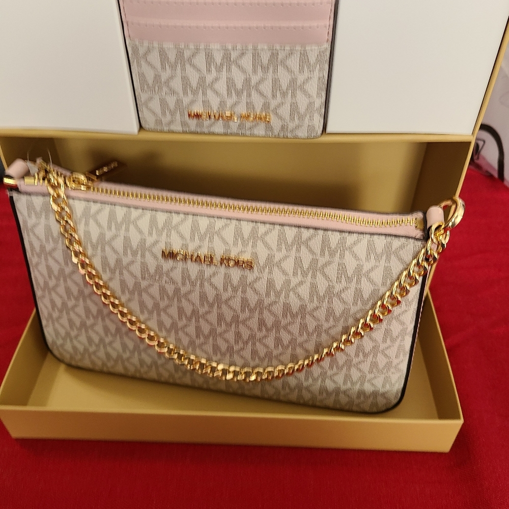 Michael kors Crossbody purse with a matching card wallet and detachable strap.